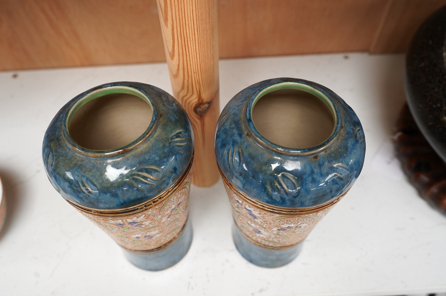 A pair of Royal Doulton Lambeth stoneware vases, 20cm high. Condition - good